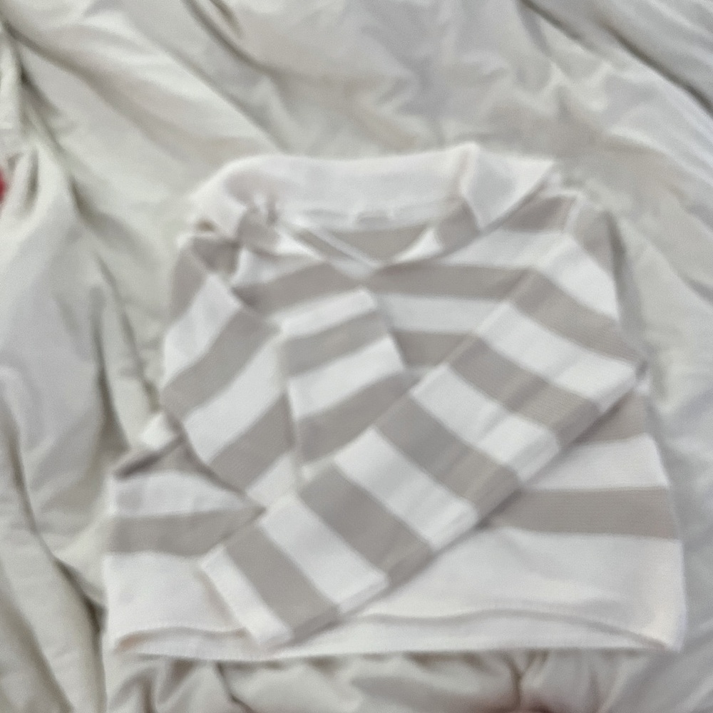 White and cream striped sweater.